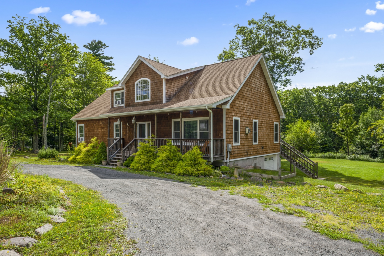 The Mountain House at Kaaterskill Falls surrounded by summer greenery