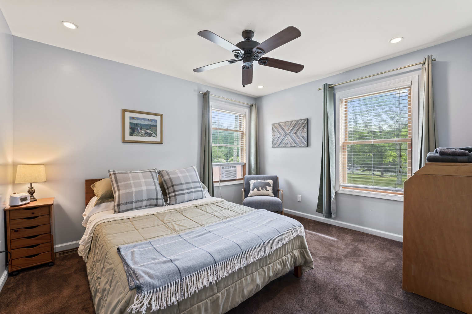 Bright queen bedroom with gray and green accents